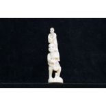 Oriental ivory figure depicting man & child standi