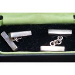 Silver pair of cufflinks