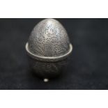 White metal pin cushion in the from of an egg