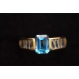 9ct Gold ring set with central blue gem stone & wh