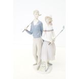 Lladro golfing couple with box No 1453 Height 34 c