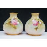 Pair of Royal Worcester bud vases with floral deco