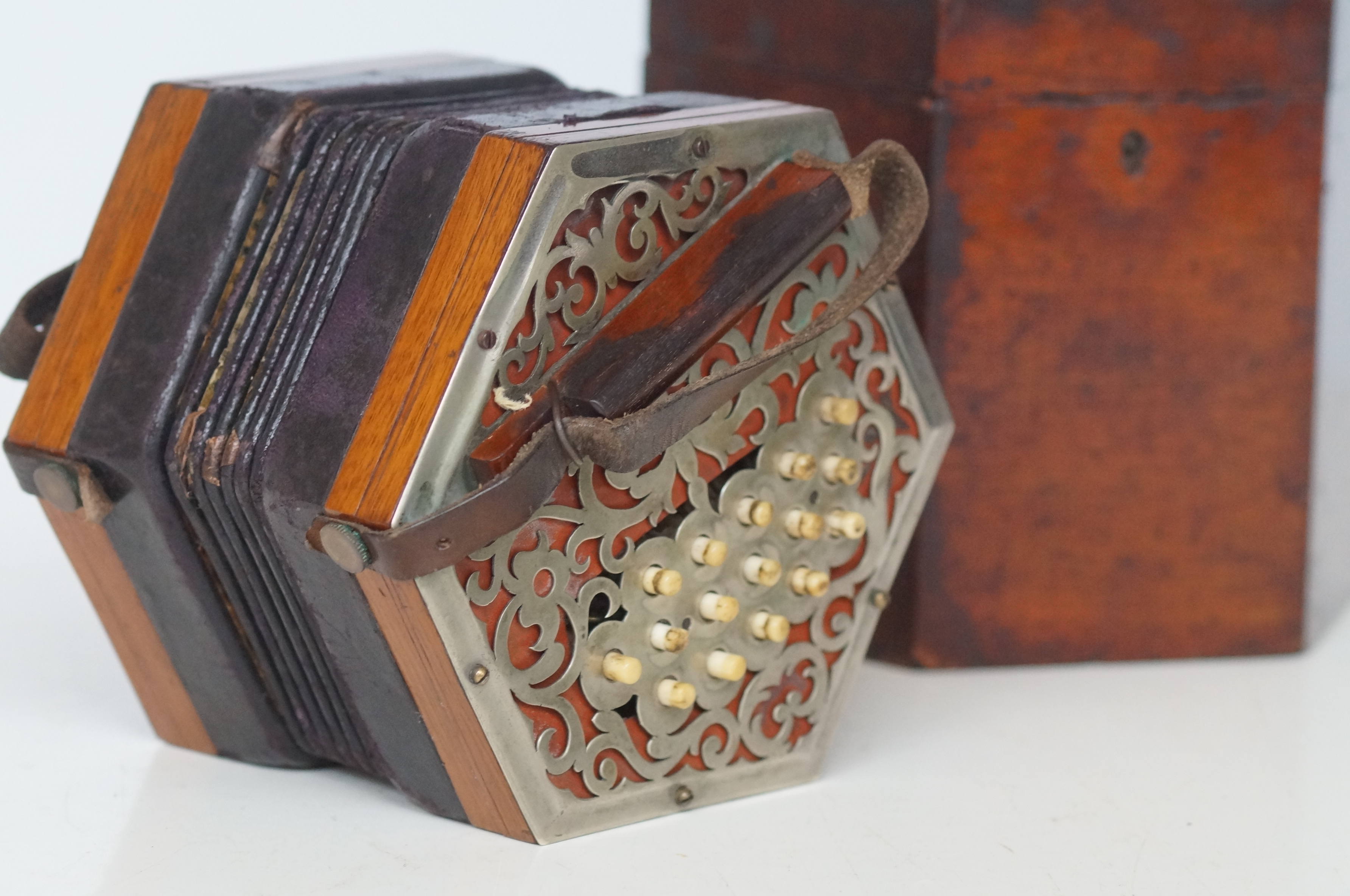 33 Button cased concertina, in need of some restor