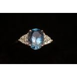 18ct White gold ring set with blue gem stone & dia