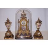 A French second empire napoleon gilt brass and porcelain clock garniture circa 1850, gilt brass case