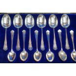 Cased set of 12 silver spoons, all inscribed E A K