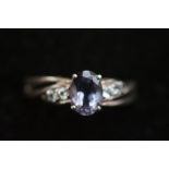 9ct White gold ring set with central blue stone &