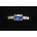 9ct Gold ring set with blue gem stone & diamond sh