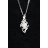 9ct White gold pendant with central opal & chip di