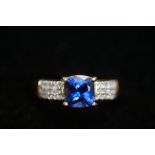 18ct Yellow gold ring set with deep blue gem stone