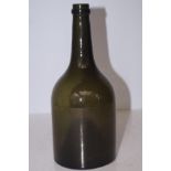 A 19th Century green glass bottle with string neck