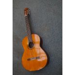 Yamaha acoustic guitar with soft vase