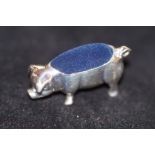 Silver pig pin cushion