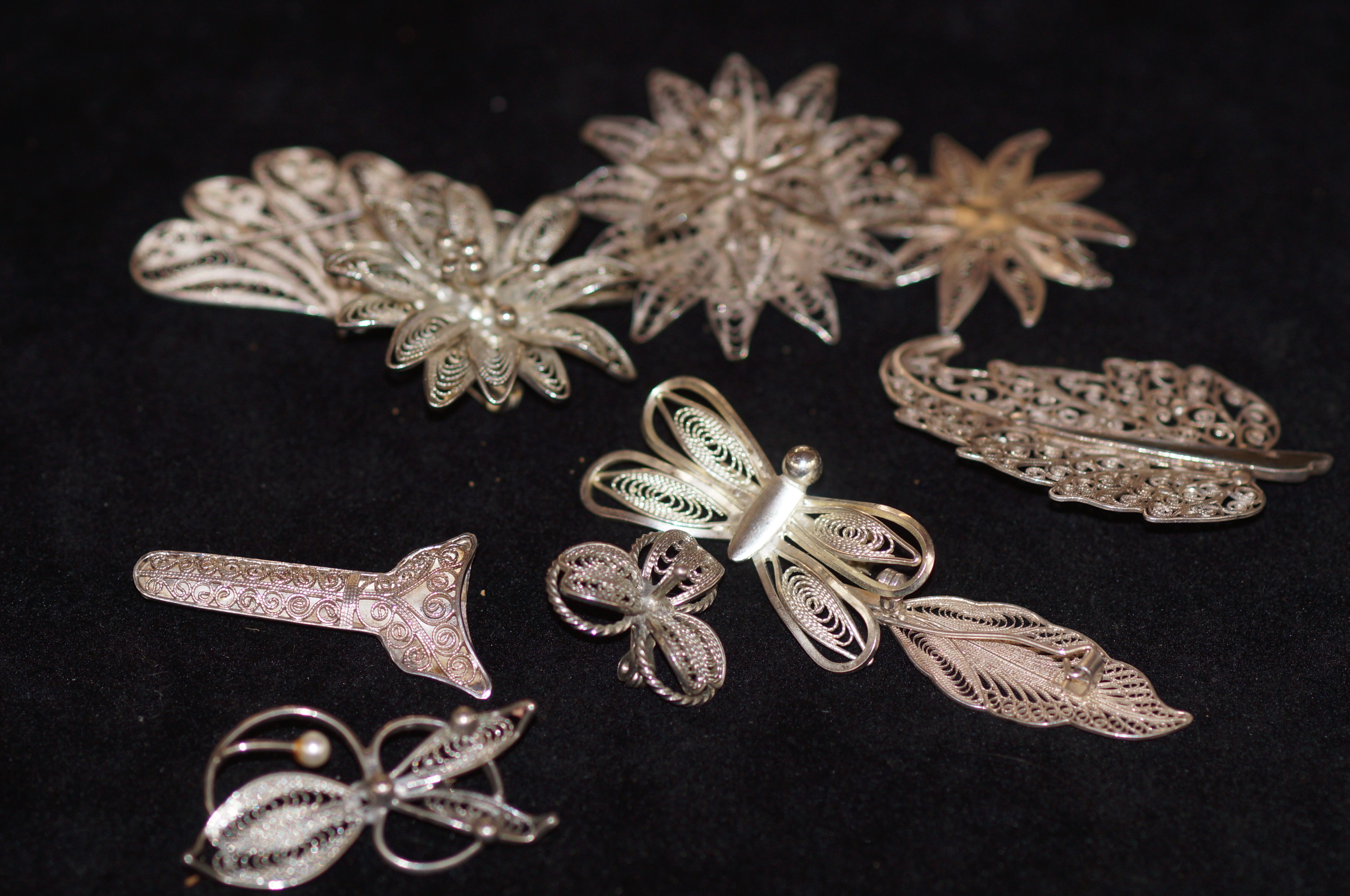10 White metal brooches possibly silver