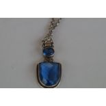 Silver necklace with large blue stones