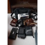 6 Vintage cameras together with a sharp camcorder