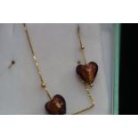 Pair of 9ct Gold earrings set with heart shaped st