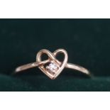 9ct Gold solitaire diamond in heart ring