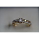 9ct gold solitaire diamond ring set with 9 diamond