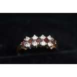 9ct Gold ring set with 5 red stones