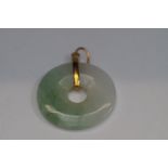 Jade pendant & yellow metal mount