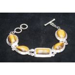 Possibly silver bracelet set with tigers eye