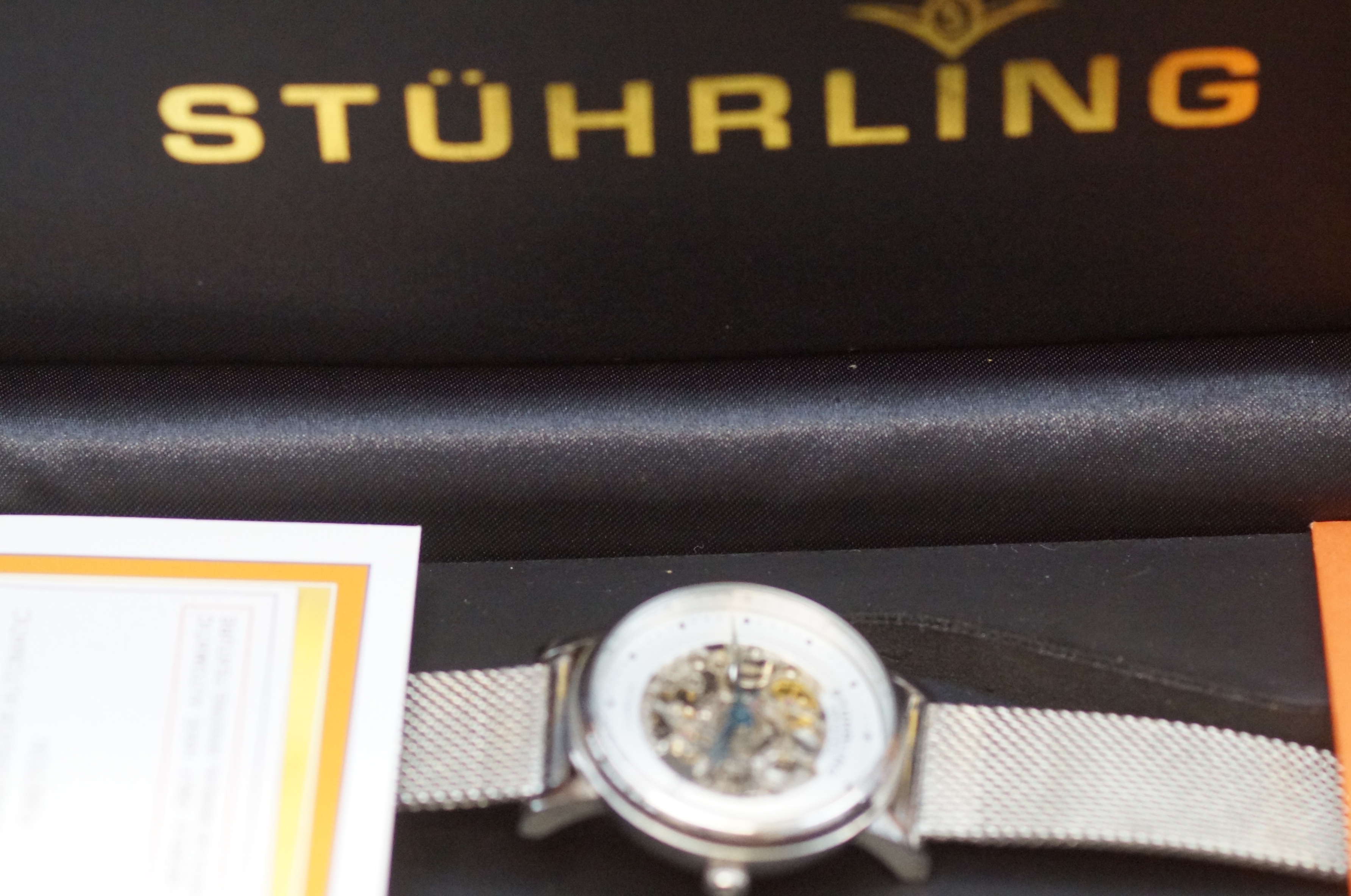 Stuhrling ladies skeleton wristwatch with box & pa