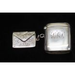 Silver vesta case together with silver stamp holde