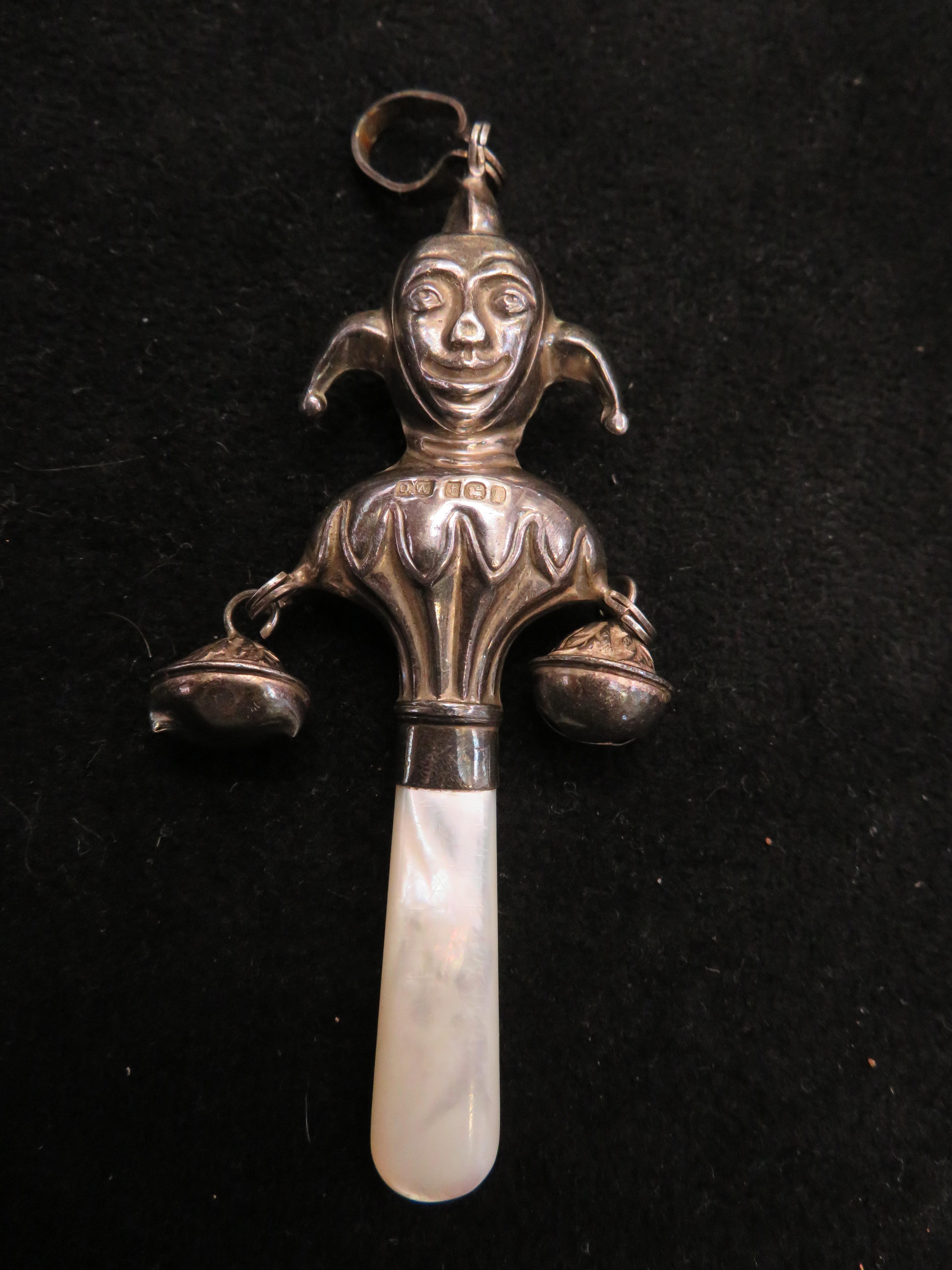 Baby's silver rattle in the form of a jester, with