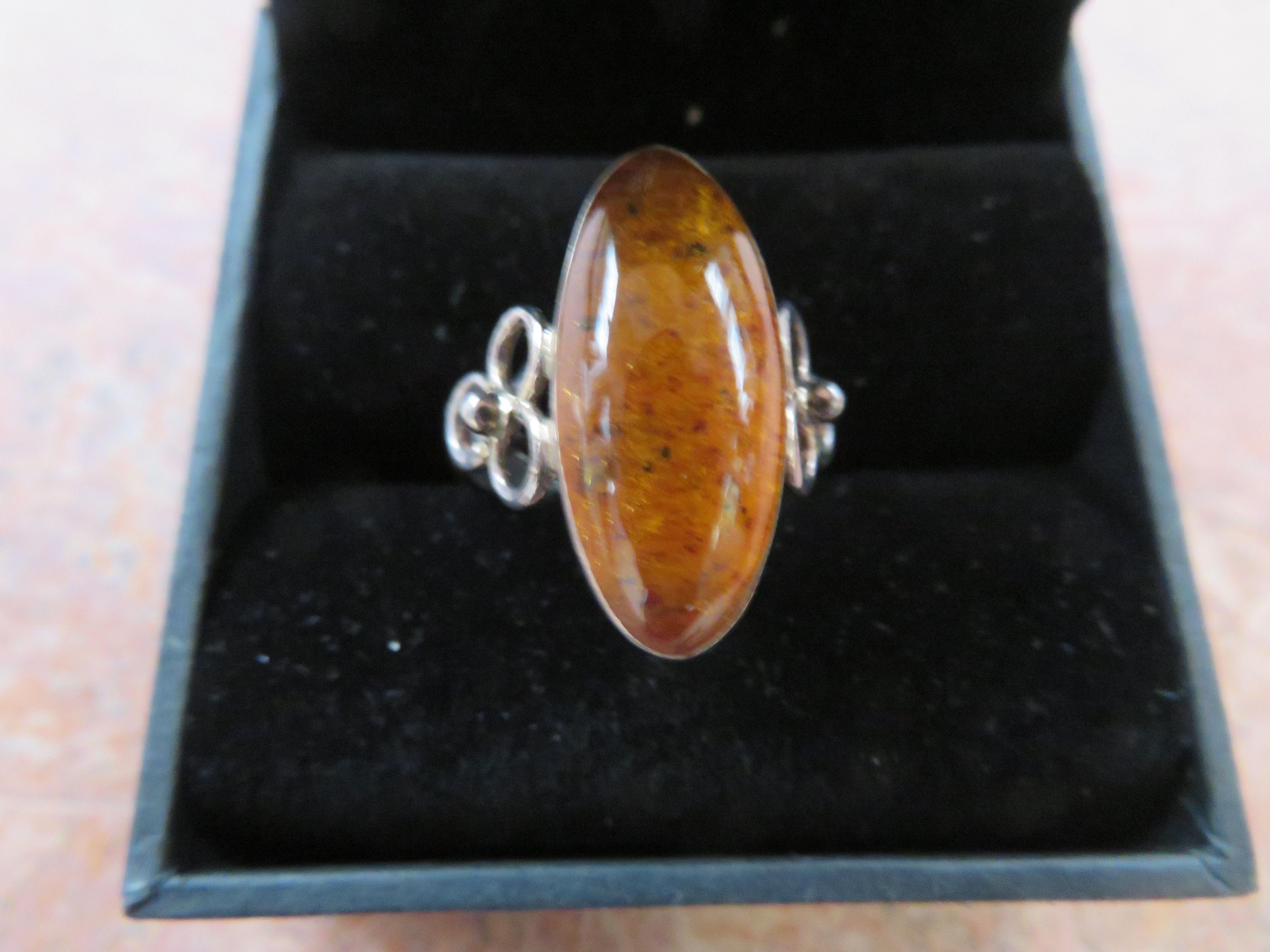 Genuine amber dress ring set in silver with coa