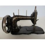 Small ornate sewing machine Width 32 cm