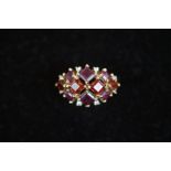 9ct Gold ring set with 4 red & 6 purple stones Siz