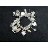 Silver charm bracelet 14 charms