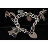 Silver charm bracelet, 8 charms