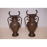 Pair of bronze twin handled vases Height 25 cm