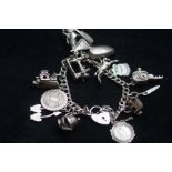 Silver charm bracelet, 15 charms