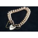 9ct Gold bracelet with heart shaped pendant & safe