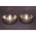 A pair of tribal silver bowls 10cm