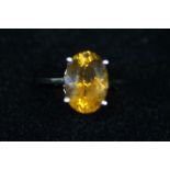 10ct gold ring set with large amber stone