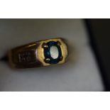 9ct gold gents ring set with diamonds and blue sto