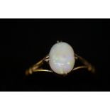 18 ct gold ring set with single oval opal size- M