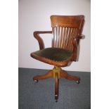 Early oak office swivel chair with heavy metal und