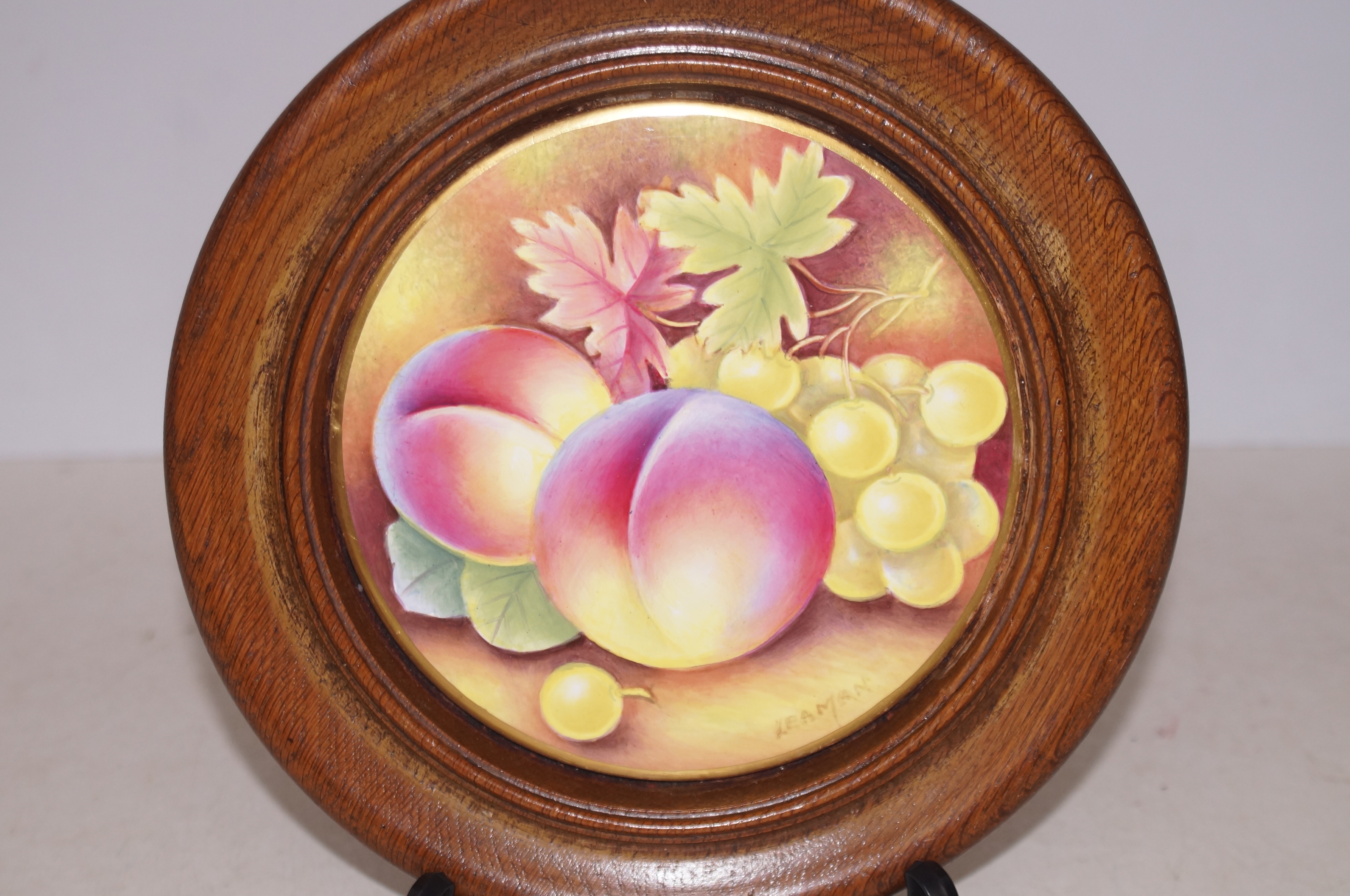 Hand painted fruit round plaque signed Leaman