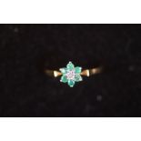 18ct Gold diamond ring set with green stones Size