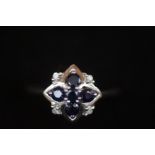 9ct White gold ring set with 5 dark blue stones &