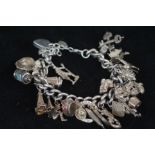 Silver charm bracelet, 25 charms