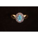 9ct Gold ring set with large light blue stone Size