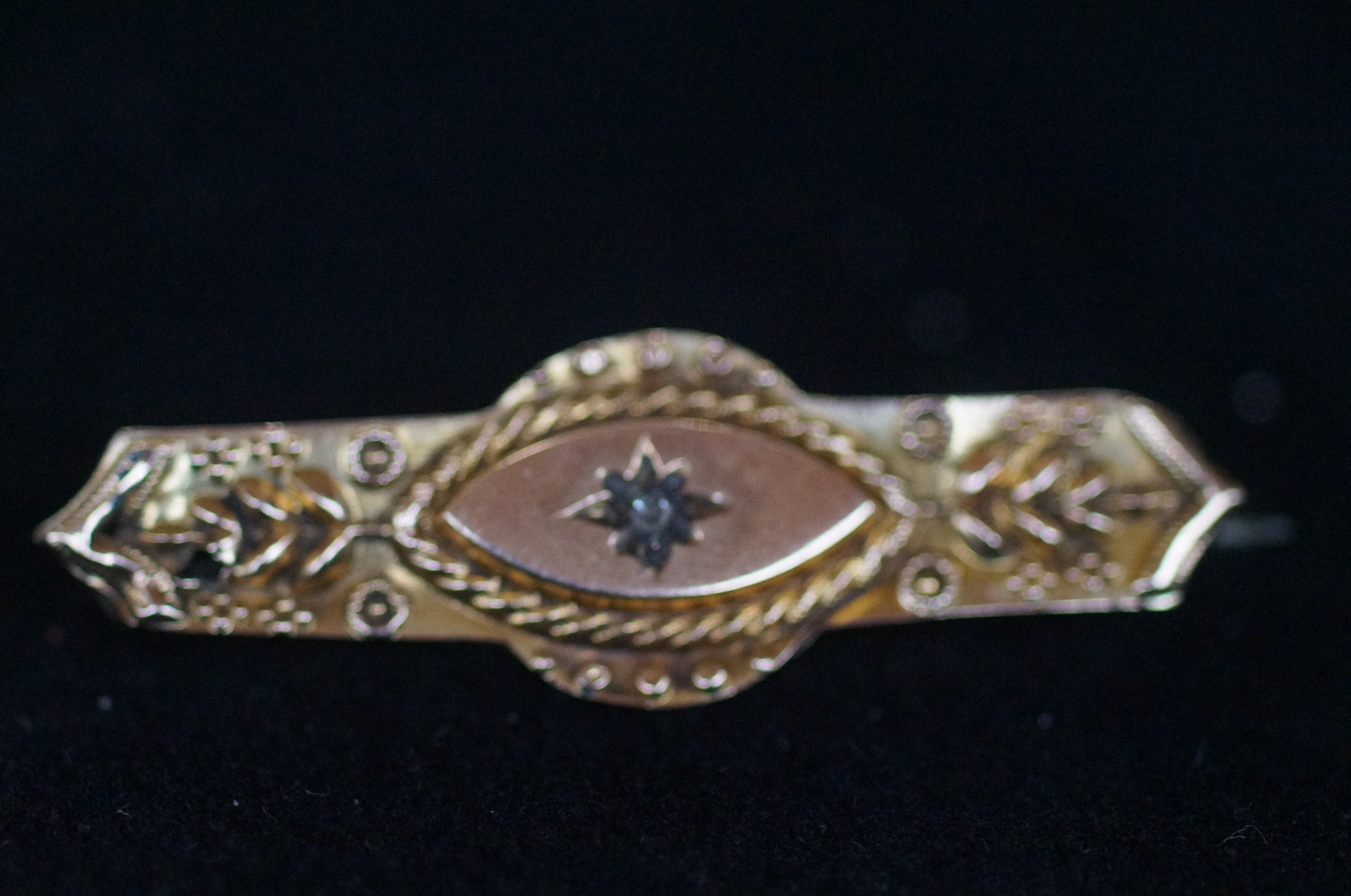 9ct Gold brooch set with small central diamond