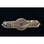9ct Gold brooch set with small central diamond
