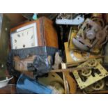 A box of clock parts for spares and repair